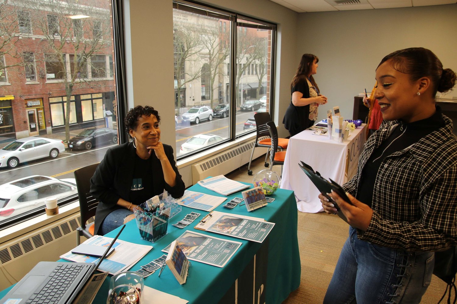 Employers and job seekers at a Fair Chance Job Fair table