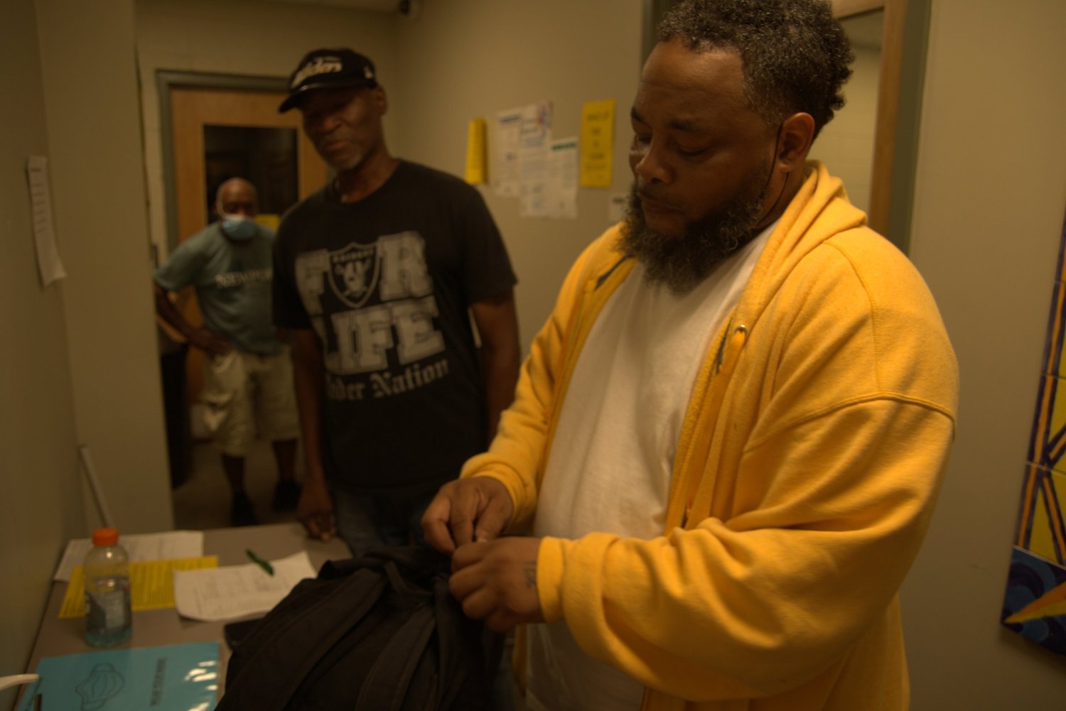 Shelter residents and staff in a hallway at an OpenDoors shelter