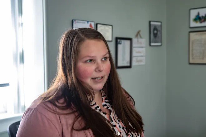 Foundations Program Coordinator Cara Cote speaking in her office