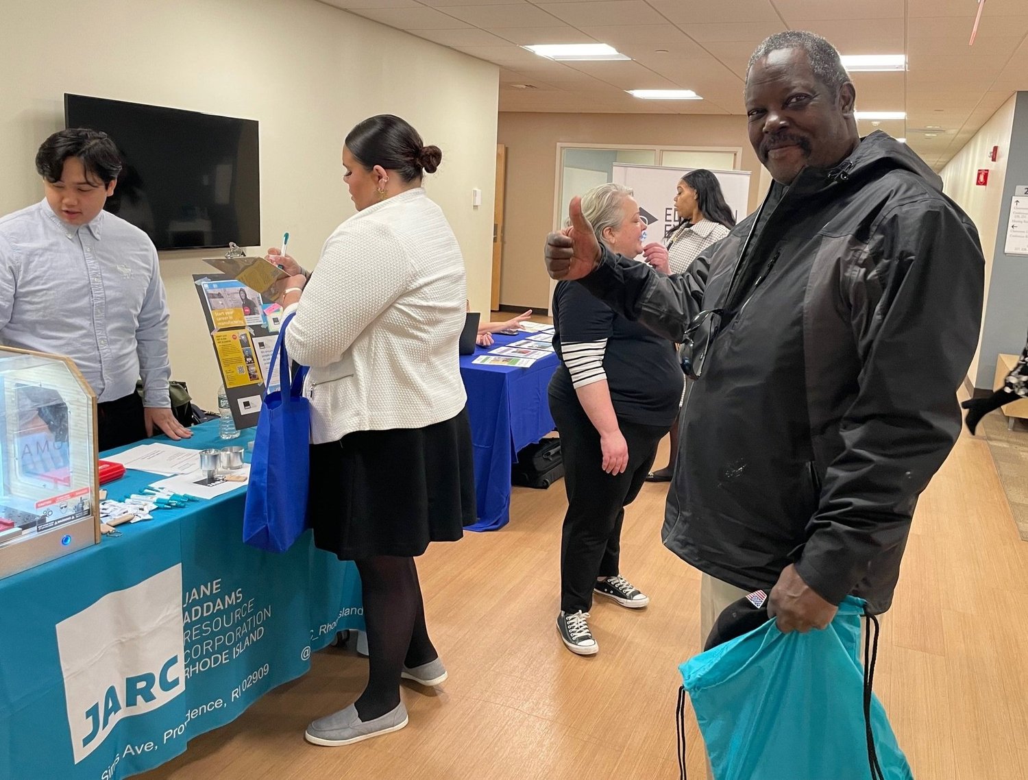 Job seekers visiting an employer table at the Fair Chance Job Fair