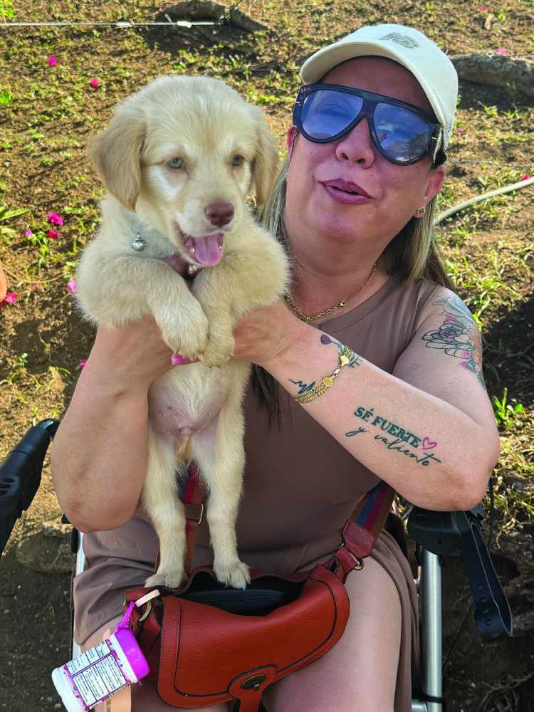 Jessica Vega holding a puppy