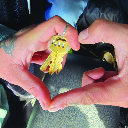 A client holding the keys to a new apartment
