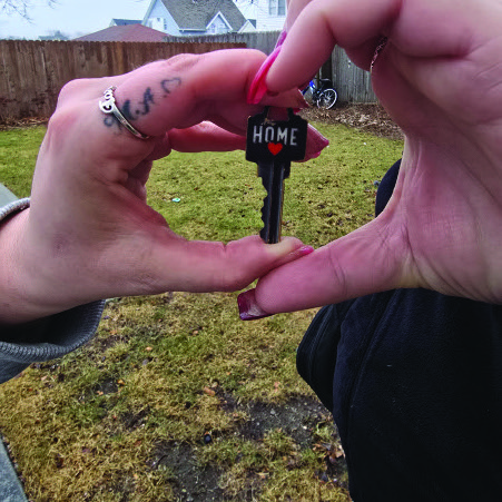 A client holding the keys to a new apartment