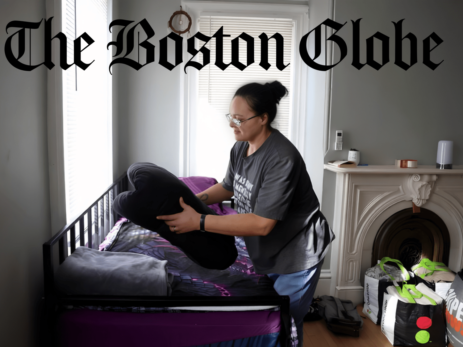 Boston Globe photo of a woman making a bed in her room